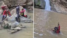 Mergulhadores dos bombeiros durante busca de menino em cachoeira