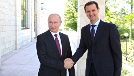 Vladimir Putin e o então presidente da Síria, Bashar Al-Asad