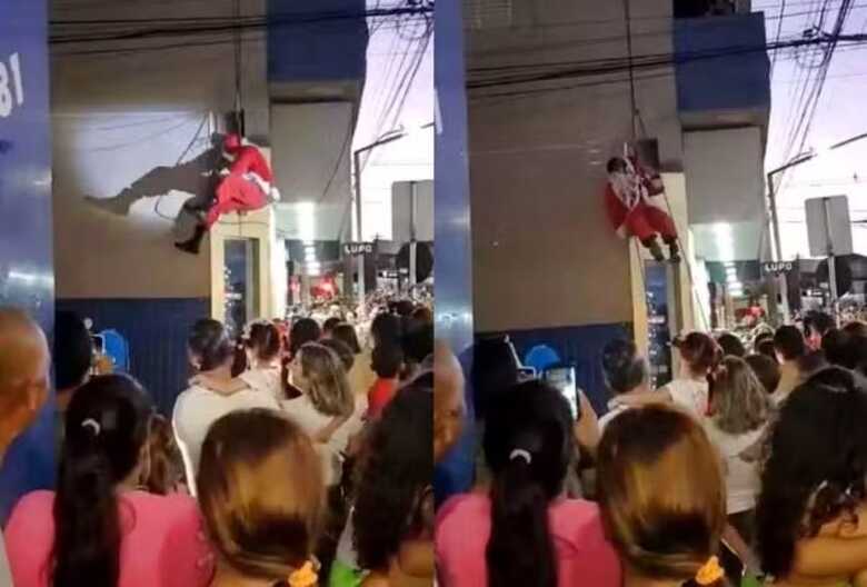 Papai Noel se enrosca e fica pendurado durante parada natalina em Itajub&aacute;
